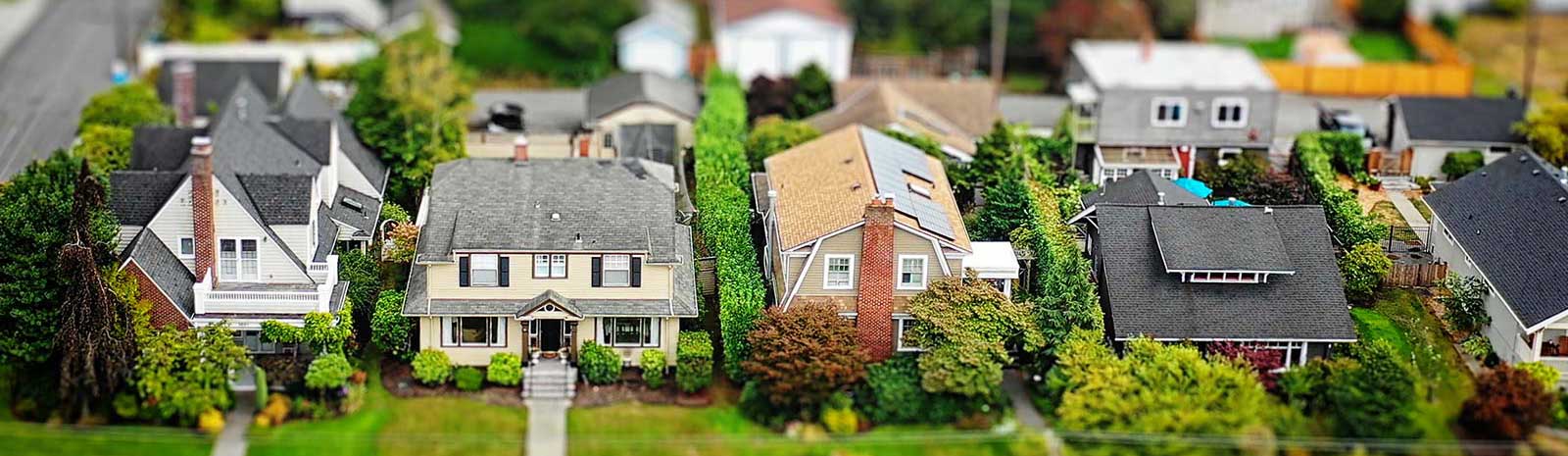 Tilt shift photo of neighborhood houses.