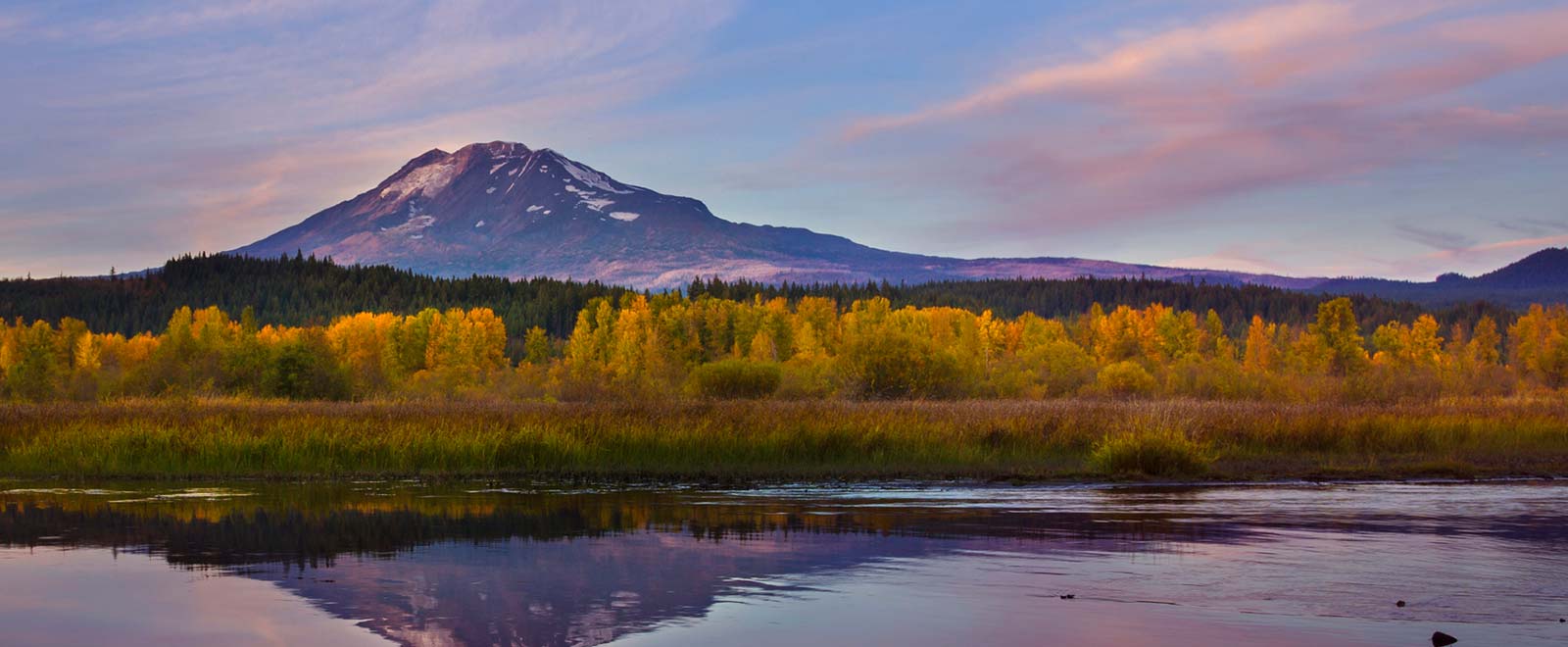 Mountain and water views at sunset.